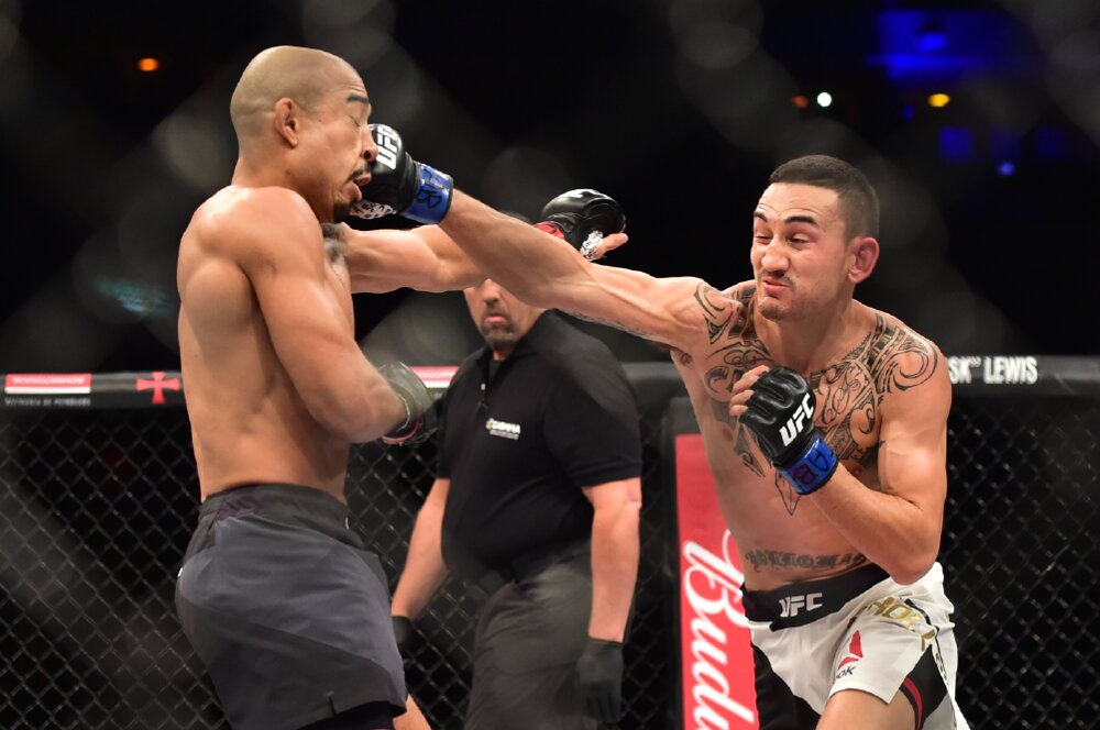 Jun 3, 2017; Rio de Janeiro, RJ, Brazil; Jose Aldo ?(red gloves) vs. Max "Blessed" Holloway? (blue gloves)?? during UFC 212 at Jeunesse Arena. Mandatory Credit: Jason Silva-USA TODAY Sports