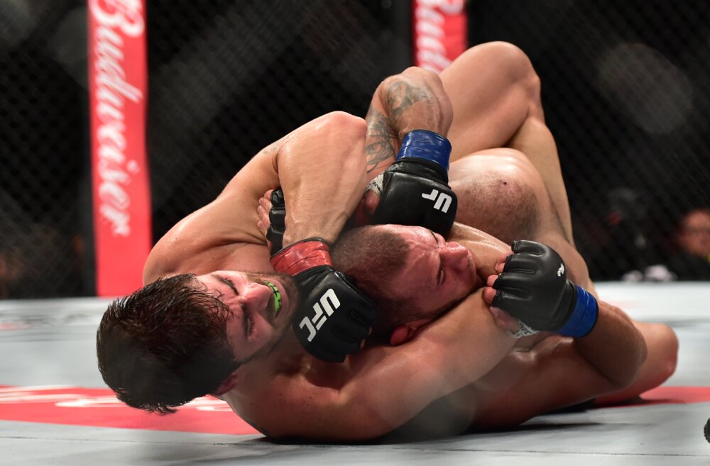 Jun 3, 2017; Rio de Janeiro, RJ, Brazil; Antonio Carlos "Cara de Sapato" Junior ?(red gloves) vs. Eric "Zebrinha" Spicely? (blue gloves)? during UFC 212 at Jeunesse Arena. Mandatory Credit: Jason Silva-USA TODAY Sports